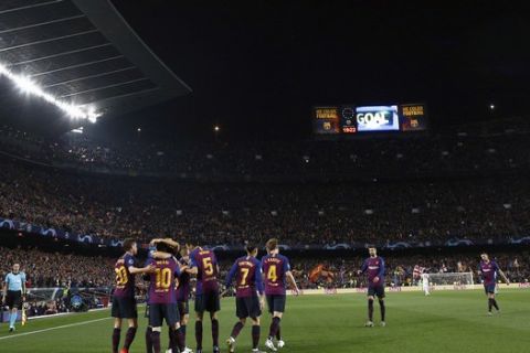 Barcelona forward Lionel Messi celebrates with teammates after scoring his side's second goal during the Champions League quarterfinal, second leg, soccer match between FC Barcelona and Manchester United at the Camp Nou stadium in Barcelona, Spain, Tuesday, April 16, 2019. (AP Photo/Manu Fernandez)