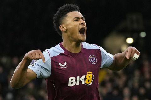 Aston Villa's Ollie Watkins celebrates after scoring his second goal during the English Premier League soccer match between Fulham and Aston Villa at Craven cottage stadium in London, Saturday, Feb. 17, 2024. (AP Photo/Alastair Grant)