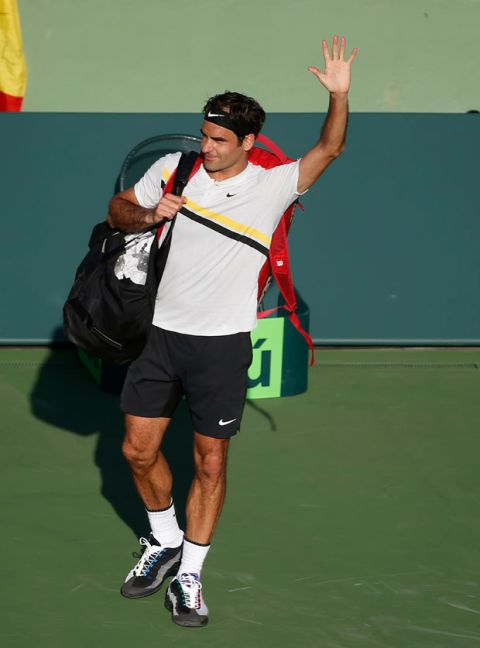 Roger Federer, of Switzerland, waves to the crowd after his loss to Thanasi Kokkinakis, of Australia, at the Miami Open tennis tournament Saturday, March 24, 2018, in Key Biscayne, Fla. (AP Photo/Wilfredo Lee)