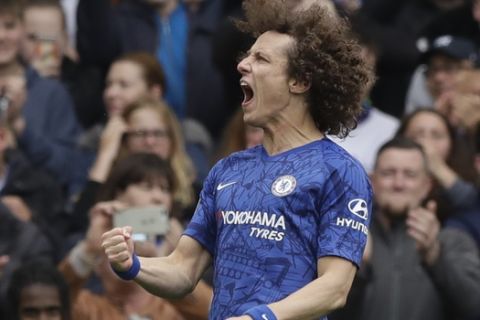 Chelsea's David Luiz celebrates after scoring his side's second goal during the English Premier League soccer match between Chelsea and Watford at Stamford Bridge stadium in London, Sunday, May 5, 2019. (AP Photo/Matt Dunham)