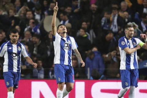 Porto forward Soares, center, celebrates after scoring the opening goal during the Champions League round of 16, 2nd leg, soccer match between FC Porto and AS Roma at the Dragao stadium in Porto, Portugal, Wednesday, March 6, 2019. (AP Photo/Luis Vieira)