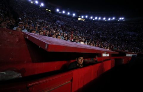 Fans look on during an exhibition tennis match between Roger Federer of Switzerland and Germany's Alexander Zverev in Plaza de Toros bullring in Mexico City, Saturday, Nov. 23, 2019. Saturday's match was the fourth stop in a tour of Latin America by the tennis greats. (AP Photo/Rebecca Blackwell)
