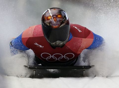 Joseph Luke Cecchini of Italy brakes in the finish area after his second run during the men's skeleton competition at the 2018 Winter Olympics in Pyeongchang, South Korea, Thursday, Feb. 15, 2018. (AP Photo/Wong Maye-E)