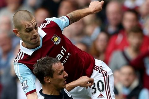 LONDON, ENGLAND - SEPTEMBER 21: Mladen Petric of West Ham tackles Phil Jagielka of Everton during the Barclays Premier League match between West Ham United and Everton at the Boleyn Ground on September 21, 2013 in London, England. (Photo by Ian Walton/Getty Images)