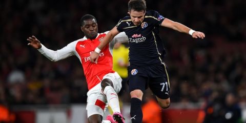 LONDON, ENGLAND - NOVEMBER 24:  Alexandru Matel of Dinamo Zagreb (r) is tackled by Joel Campbell of Arsenal during the UEFA Champions League match between Arsenal FC and GNK Dinamo Zagreb at Emirates Stadium on November 24, 2015 in London, United Kingdom.  (Photo by Shaun Botterill/Getty Images)