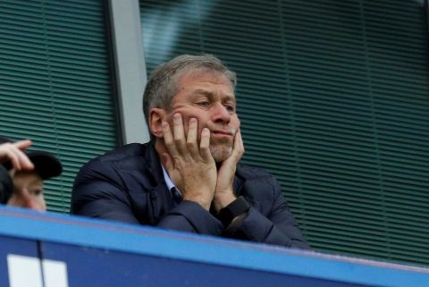 FILE - In this file photo dated Saturday, Dec. 19, 2015, Chelsea soccer club owner Roman Abramovich sits in his box before the English Premier League soccer match between Chelsea and Sunderland at Stamford Bridge stadium in London.  According to a joint statement Monday Aug. 7, 2017, 50-year old Russian tycoon Roman Abramovich and his wife Dasha Zhukova have announced their impending divorce, after ten years together. (AP Photo/Matt Dunham, FILE)
