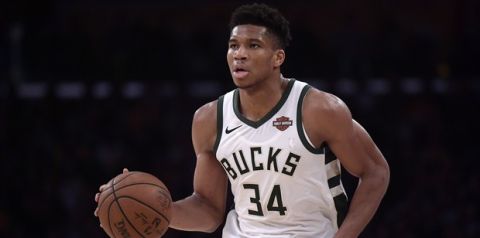 Milwaukee Bucks forward Giannis Antetokounmpo dribbles during the second half of an NBA basketball game against the Los Angeles Lakers Friday, March 1, 2019, in Los Angeles. The Bucks won 131-120. (AP Photo/Mark J. Terrill)