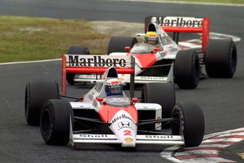 FILE - In this Oct. 22, 1989 file photo, French McLaren-Honda driver Alain Prost is chased by Brazilian teammate Ayrton Senna during the Japanese Formula One Grand Prix at Suzuka Circuit in Suzuka, central Japan. Japanese car manufacturer Honda is returning to Formula One in 2015 as an engine supplier to the automaker's former partner McLaren of Britain, Honda President Takanobu Ito announced the decision at a press conference in Tokyo on Thursday, May 16, 2013. (AP Photo/Tsugufumi Matsumoto, File)