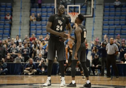 Central Floridas Tacko Fall, left, and Central Floridas Tanksley Efianayi, right, in the first half of an NCAA college basketball game, Sunday, Jan. 8, 2017, in Hartford, Conn. (AP Photo/Jessica Hill)