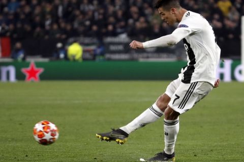 Juventus' Cristiano Ronaldo attempts a shot at goal during the Champions League round of 16, 2nd leg, soccer match between Juventus and Atletico Madrid at the Allianz stadium in Turin, Italy, Tuesday, March 12, 2019. (AP Photo/Antonio Calanni)