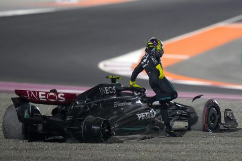 Mercedes driver Lewis Hamilton of Britain goes out from his car after a crash at the start of the Qatar Formula One Grand Prix auto race at the Lusail International Circuit, in Lusail, Qatar, Sunday, Oct. 8, 2023. (AP Photo/Darko Bandic)