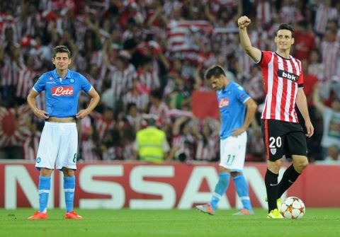 Athletic Bilbao's forward Aritz Aduriz (R) celebrates after scoring his second goal during the UEFA Champions League play-off second leg football match Athletic Bilbao vs SSC Napoli at the San Mames stadium in Bilbao on August 27, 2014.  AFP PHOTO / RAFA RIVAS        (Photo credit should read RAFA RIVAS/AFP/Getty Images)