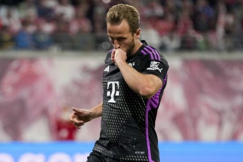 Bayern's Harry Kane celebrates scoring his side's opening goal from the penalty spot during the German Bundesliga soccer match between Leipzig and Bayern Munich, at the Red Bull Arena stadium in Leipzig, Germany, Saturday, Sept. 30, 2023. (AP Photo/Matthias Schrader)