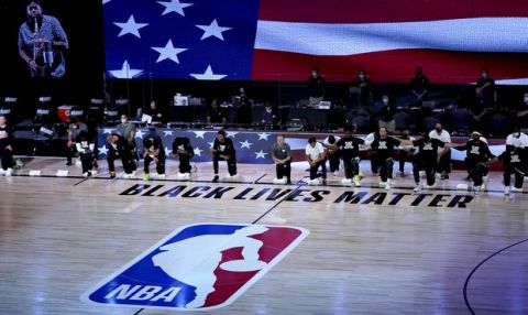 Players kneel in honor of the Black Lives Matter movement during the playing of the national anthem during the first half of an NBA basketball first round playoff game between the Utah Jazz and the Denver Nuggets, Monday, Aug. 17, 2020, in Lake Buena Vista, Fla. (AP Photo/Ashley Landis, Pool)