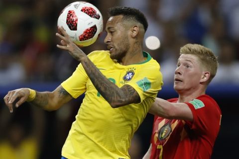 Brazil's Neymar, left, and Belgium's Kevin De Bruyne go for a header during the quarterfinal match between Brazil and Belgium at the 2018 soccer World Cup in the Kazan Arena, in Kazan, Russia, Friday, July 6, 2018. (AP Photo/Francisco Seco)