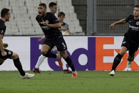 Eintracht Frankfurt's Luka Jovic, right, reacts with Filip Kostic ,left, and Simon Valette, center, after scoring his side second goal during the Europa League, group H soccer match between Marseille and Eintracht Frankfurt played behind closed doors at the Velodrome stadium in Marseille, southern France, Thursday Sept. 20, 2018. (AP Photo/Claude Paris)