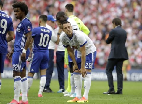 Chelsea's John Terry stands on the pitch after his team lost the English FA Cup final soccer match between Arsenal and Chelsea at the Wembley stadium in London, Saturday, May 27, 2017. (AP Photo/Matt Dunham)