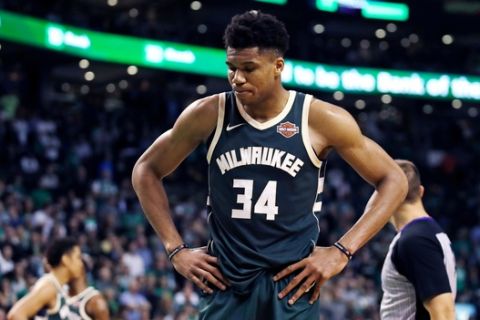 Milwaukee Bucks forward Giannis Antetokounmpo pauses after a basket by Boston Celtics guard Terry Rozier during the fourth quarter of Game 7 of an NBA basketball first-round playoff series in Boston, Saturday, April 28, 2018. The Celtics won 112-96, eliminating the Bucks from the playoffs. (AP Photo/Charles Krupa)