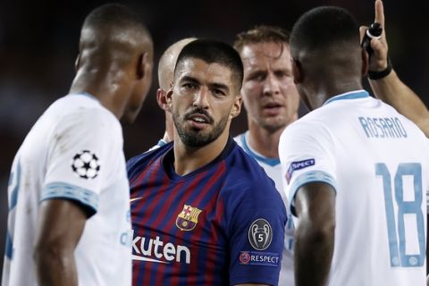 Barcelona forward Luis Suarez, center, reacts during the group B Champions League soccer match between FC Barcelona and PSV Eindhoven at the Camp Nou stadium in Barcelona, Spain, Tuesday, Sept. 18, 2018. (AP Photo/Manu Fernandez)