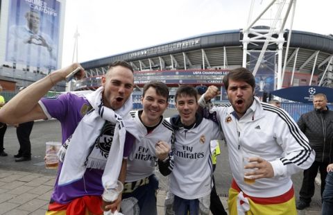 Real Madrid fans pose for a photo outside the stadium prior to the Champions League soccer final at the National Stadium, Cardiff, Wales, Saturday June 3, 2017. Juventus and Real Madrid meet in the biggest club game in world soccer Saturday. (Martin Rickett/PA via AP)