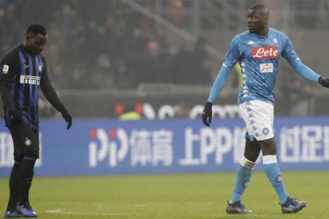In this image taken on Wednesday, Dec.26, Napoli's Kalidou Koulibaly, right, leaves the pitch after receiving a red card from the referee 2018 during a Serie A soccer match between Inter Milan and Napoli, at the San Siro stadium in Milan, Italy. At left is Inter Milan's Kwadwo Asamoah. Cristiano Ronaldo has come to the defense of Kalidou Koulibaly after the Napoli defender was the target of racist chants during a match at Inter Milan. Next to a photo of him being marked by Koulibaly during a match earlier this season, Ronaldo writes on Instagram, "In the world and in football there always needs to be education and respect. No to racism and to any sort of insult and discrimination!!!". (AP Photo/Luca Bruno, File)