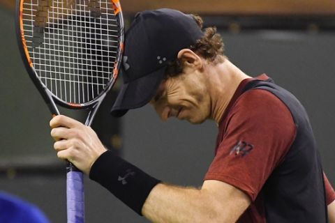 Andy Murray, of Great Britain, reacts after losing a point to Vasek Pospisil, of Canada, at the BNP Paribas Open tennis tournament, Saturday, March 11, 2017, in Indian Wells, Calif. Pospisil won the match 6-4, 7-6 (5). (AP Photo/Mark J. Terrill)