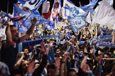 Napoli's football fans celebrate the victory of their team in Naples on May 20, 2012. S.S.C. Juventus' record-breaking 43-match undefeated run came to an end when Napoli won the Italian Cup 2-0.  AFP PHOTO/ ANDREA BALDO        (Photo credit should read ANDREA BALDO/AFP/GettyImages)