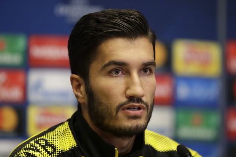 Dortmund's Nuri Sahin speaks during a press conference before a training session at Wembley stadium in London, Tuesday, Sept. 12, 2017. Dortmund play Tottenham Hotspur in a Champions League Group H soccer match at Wembley on Wednesday. (AP Photo/Matt Dunham)