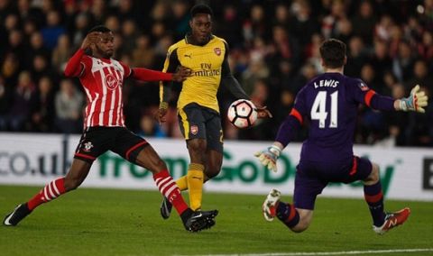 Arsenal's English striker Danny Welbeck scores their first goal during the English FA Cup fourth round football match between Southampton and Arsenal at St Mary's in Southampton, southern England on January 28, 2017. / AFP PHOTO / Adrian DENNIS / RESTRICTED TO EDITORIAL USE. No use with unauthorized audio, video, data, fixture lists, club/league logos or 'live' services. Online in-match use limited to 75 images, no video emulation. No use in betting, games or single club/league/player publications.  / ADRIAN DENNIS/AFP/Getty Images