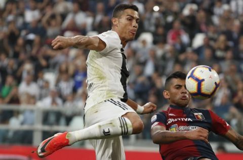 Juventus' Cristiano Ronaldo tries to score during an Italian Serie A soccer match between Juventus and Genoa, at the Alliance stadium in Turin, Italy, Saturday, Oct. 20, 2018. (AP Photo/Antonio Calanni)