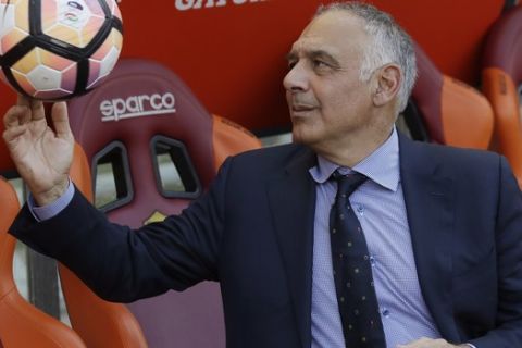 AS Roma president James Pallotta plays with a ball prior to an Italian Serie A soccer match between Roma and Genoa at the Olympic stadium in Rome, Sunday, May 28, 2017. Francesco Totti is playing his final match with Roma against Genoa after a 25-season career with his hometown club. (AP Photo/Alessandra Tarantino)