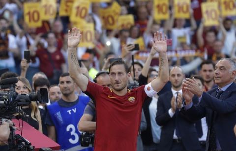 Roma President James Pallotta, right, applauds as Francesco Totti salutes his fans after an Italian Serie A soccer match between Roma and Genoa at the Olympic stadium in Rome, Sunday, May 28, 2017. Francesco Totti is playing his final match with Roma against Genoa after a 25-season career with his hometown club. (AP Photo/Alessandra Tarantino)