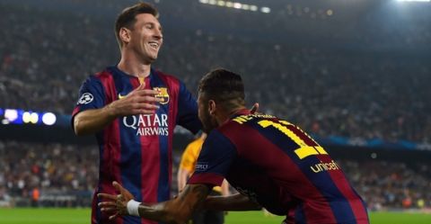 BARCELONA, SPAIN - OCTOBER 21:  Neymar (R) celebrates with his teammate Lionel Messi after scoring the opening goal of FC Barcelonaa UEFA Champions League Group F match between FC Barcelona and AFC Ajax at the Camp Nou Stadium on October 21, 2014 in Barcelona, Spain.  (Photo by David Ramos/Getty Images)