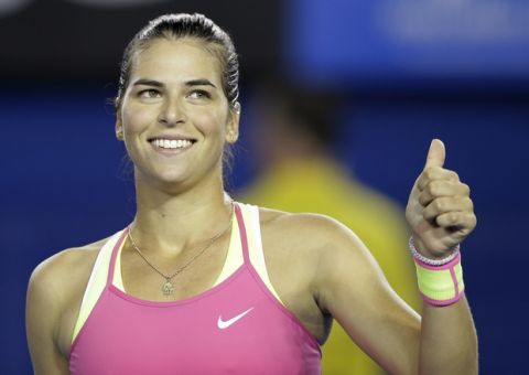 Ajla Tomljanovic of Australia celebrates after defeating Shelby Rogers of the U.S. in their first round match at the Australian Open tennis championship in Melbourne, Australia, Tuesday, Jan. 20, 2015. (AP Photo/Lee Jin-man)
