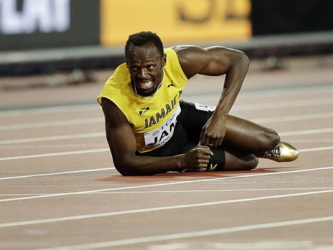 Jamaica's Usain Bolt lies on the track after he injured himself during the 4x100 m relay final during the World Athletics Championships in London Saturday, Aug. 12, 2017. (AP Photo/Tim Ireland)