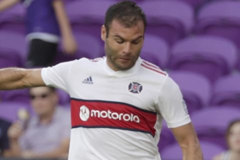Chicago Fire's Nemanja Nikolic moves the ball against Orlando City during the second half of an MLS soccer match, Sunday, Oct. 6, 2019, in Orlando, Fla. (AP Photo/John Raoux)