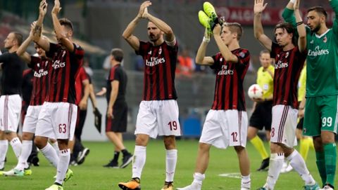 AC Milan players celebrate their 6-0 win at the end of the Europa League, play-off, first-leg soccer match between AC Milan and Shkendija, at the Milan San Siro Stadium, Italy, Thursday, Aug.17, 2017. (AP Photo/Antonio Calanni)