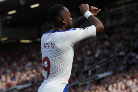 Crystal Palace's Jordan Ayew celebrates after scoring his side's first goal during their English Premier League soccer match between Manchester United and Crystal Palace at Old Trafford in Manchester, England Saturday, Aug, 24, 2019. (AP Photo/Alastair Grant)