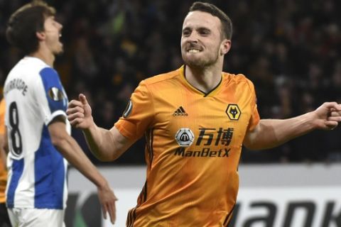 Wolverhampton Wanderers' Diogo Jota celebrates after scoring his side's opening goal during the Europa League round of 32 soccer match between Wolverhampton Wanderers and Espanyol at the Molineux Stadium, in Wolverhampton, England, Thursday Feb. 20, 2020. (AP Photo/ Rui Vieira)