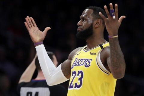 Los Angeles Lakers' LeBron James reacts after making a 3-point basket against the New Orleans Pelicans during the first half of an NBA basketball game Tuesday, Feb. 25, 2020, in Los Angeles. (AP Photo/Marcio Jose Sanchez)