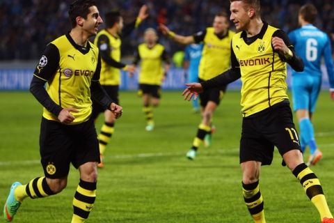 SAINT PETERSBURG, RUSSIA - FEBRUARY 25:  Marco Reus (R) of Dortmund celebrates his team's second goal with team mate Henrikh Mkhitaryan during the UEFA Champions League Round of 16 match between FC Zenit and Borussia Dortmund at Petrovsky Stadium on February 25, 2014 in Saint Petersburg, Russia.  (Photo by Alex Grimm/Bongarts/Getty Images)