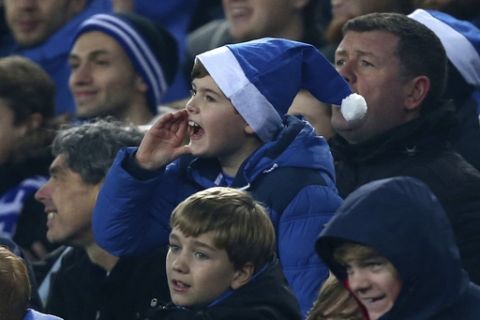 A young Everton fan shouts from the stands during the English Premier League soccer match between Everton and Liverpool at Goodison Park stadium in Liverpool, England, Monday, Dec. 19, 2016. (AP Photo/Dave Thompson)