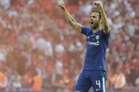 Chelsea's Cesc Fabregas celebrates after winning the English FA Cup final soccer match between Chelsea v Manchester United at Wembley stadium in London, England, Saturday, May 19, 2018. (AP Photo/Rui Vieira)