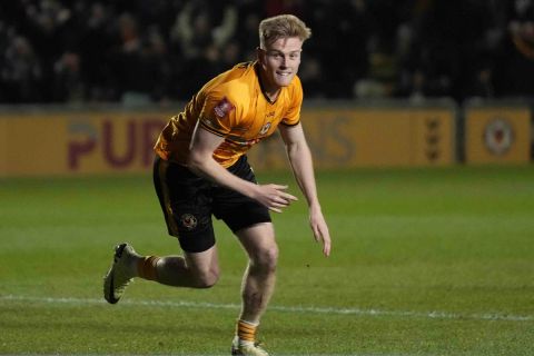 Newport's Will Evans celebrates after scoring his side's second goal during the FA Cup fourth round soccer match between Newport County and Manchester United at the Rodney Parade stadium in Newport, Wales, Sunday, Jan. 28, 2024. (AP Photo/Alastair Grant)