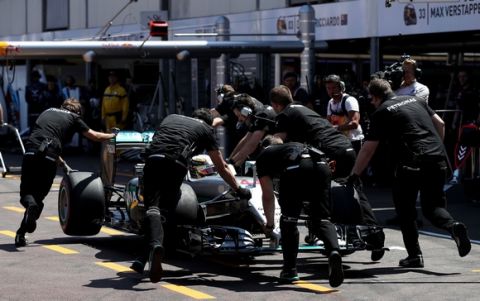 MONTE-CARLO, MONACO - MAY 28: Lewis Hamilton of Great Britain driving the (44) Mercedes AMG Petronas F1 Team Mercedes F1 WO7 Mercedes PU106C Hybrid turbo gets pushed back to his garage during qualifying for the Monaco Formula One Grand Prix at Circuit de Monaco on May 28, 2016 in Monte-Carlo, Monaco.  (Photo by Lars Baron/Getty Images)
