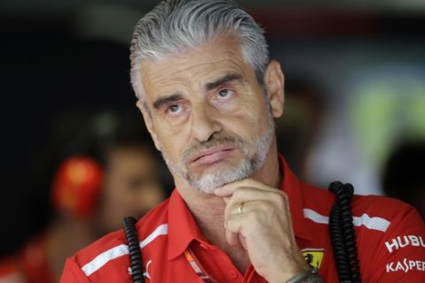 FILE - In this Sept. 1, 2018 file photo, Ferrari's team Chief Maurizio Arrivabene waits for the start of the third free practice at the Monza racetrack, in Monza, Italy. Ferrari has replaced Maurizio Arrivabene with Mattia Binotto as team principal following another failed Formula One title chase. Binotto had been working as Ferrari's chief technical officer, having been with the team for nearly 25 years. Ferrari says in a statement, After four years of untiring commitment and dedication, Maurizio Arrivabene is leaving the team. The decision was taken together with the companys top management after lengthy discussions related to Maurizios long term personal interests as well as those of the team itself. (AP Photo/Luca Bruno, File)