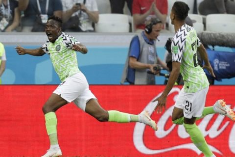 Nigeria's Ahmed Musa, left, celebrates after scoring his side's first goal during the group D match between Nigeria and Iceland at the 2018 soccer World Cup in the Volgograd Arena in Volgograd, Russia, Friday, June 22, 2018. (AP Photo/Andrew Medichini)