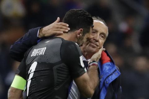 Italy goalkeeper Gianluigi Buffon is comforted by Italy coach Gian Piero Ventura after Italy failed to qualify at the end of the World Cup qualifying play-off second leg soccer match between Italy and Sweden, at the Milan San Siro stadium, Italy, Monday, Nov. 13, 2017. (AP Photo/Luca Bruno)