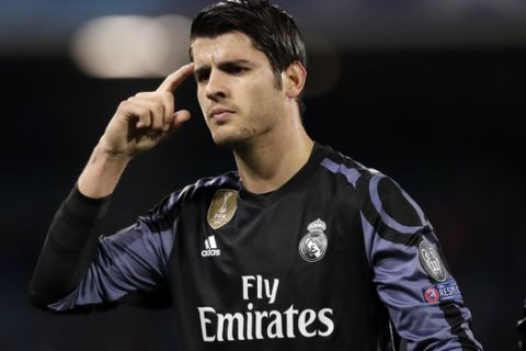 Real Madrid's Alvaro Morata gestures after scoring his side's third goal during the Champions League round of 16, second leg, soccer match between Napoli and Real Madrid at the San Paolo stadium in Naples, Italy, Tuesday March 7, 2017. (AP Photo/Andrew Medichini)