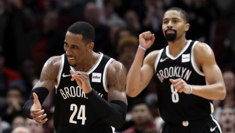 Brooklyn Nets forward Rondae Hollis-Jefferson, left, and guard Spencer Dinwiddie celebrate during the second half of an NBA basketball game against the Chicago Bulls, Wednesday, Dec. 19, 2018, in Chicago. The Nets won 96-93. (AP Photo/Nam Y. Huh)